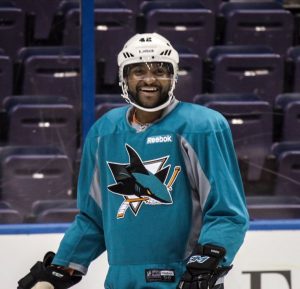 Joel Ward in San Jose Sharks uniform on ice.